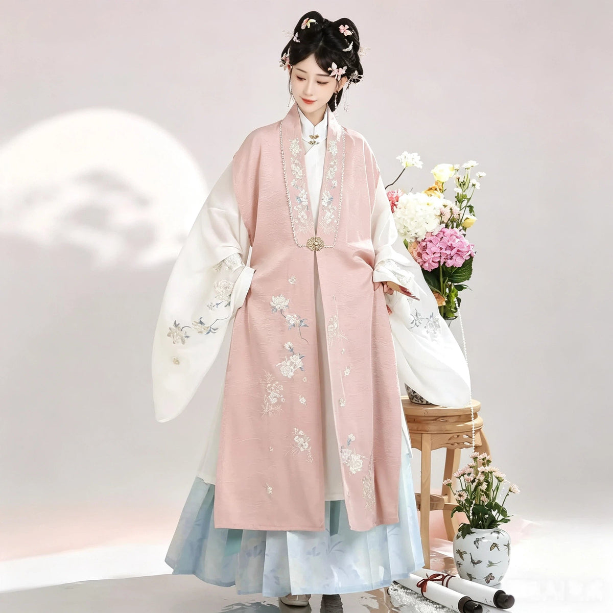 Pink sleeveless Bijia vest with a white robe and powder blue Mamianqun skirt