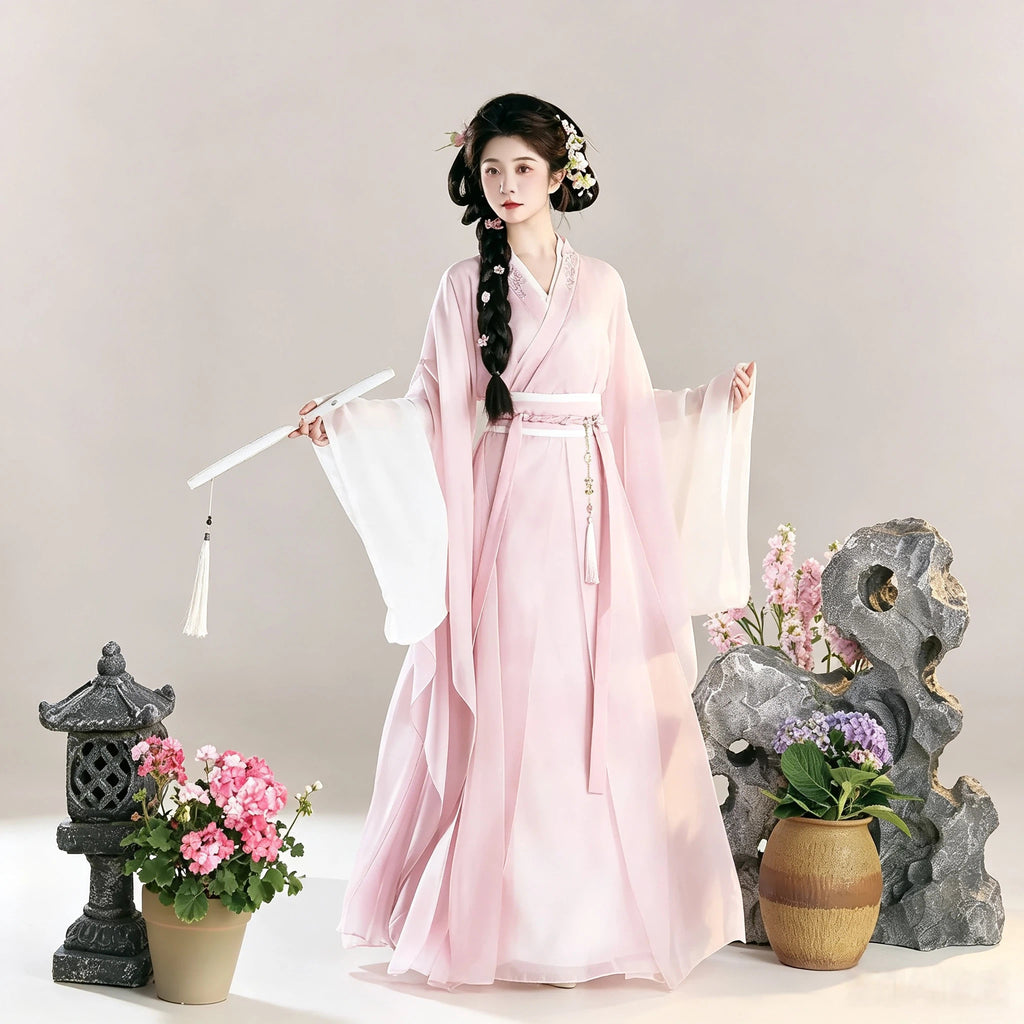 Blush pink and white Wei-Jin style Hanfu with wide sleeves and a layered skirt