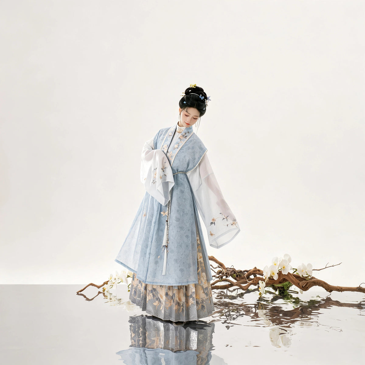Blue Hanfu vest and Mamianqun horse-face skirt with floral detailing