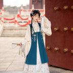 Women's Ming-style Hanfu set with a blue embroidered sleeveless vest