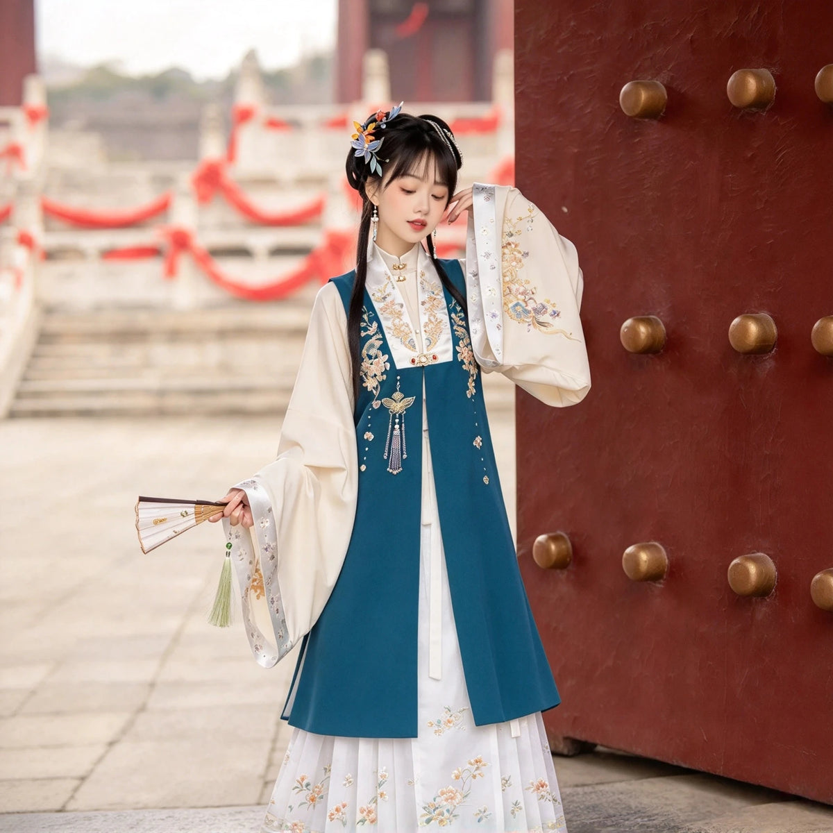 Women's Ming-style Hanfu set with a blue embroidered sleeveless vest
