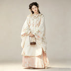 Peach and cream traditional-style Hanfu outfit with a Mamianqun skirt