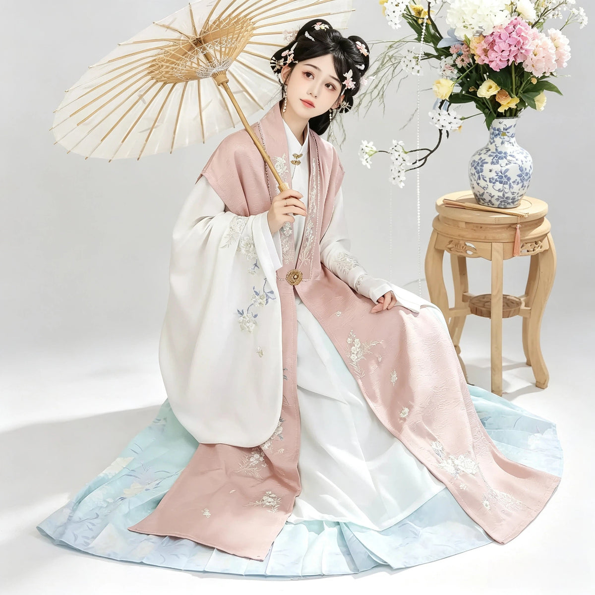 Powder blue Mamianqun horse-face skirt paired with a dusty pink Hanfu vest