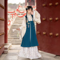 Peacock blue Bijia vest with an ivory top and white pleated Hanfu skirt