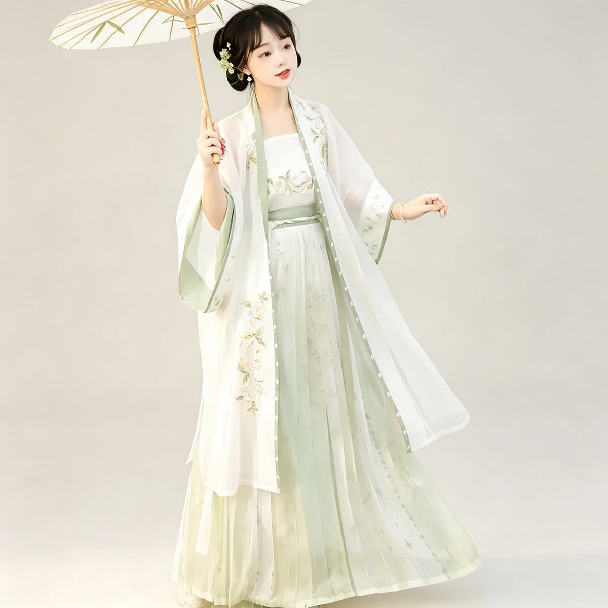 Women's pale green Beizi outer layer over a white Hanfu outfit