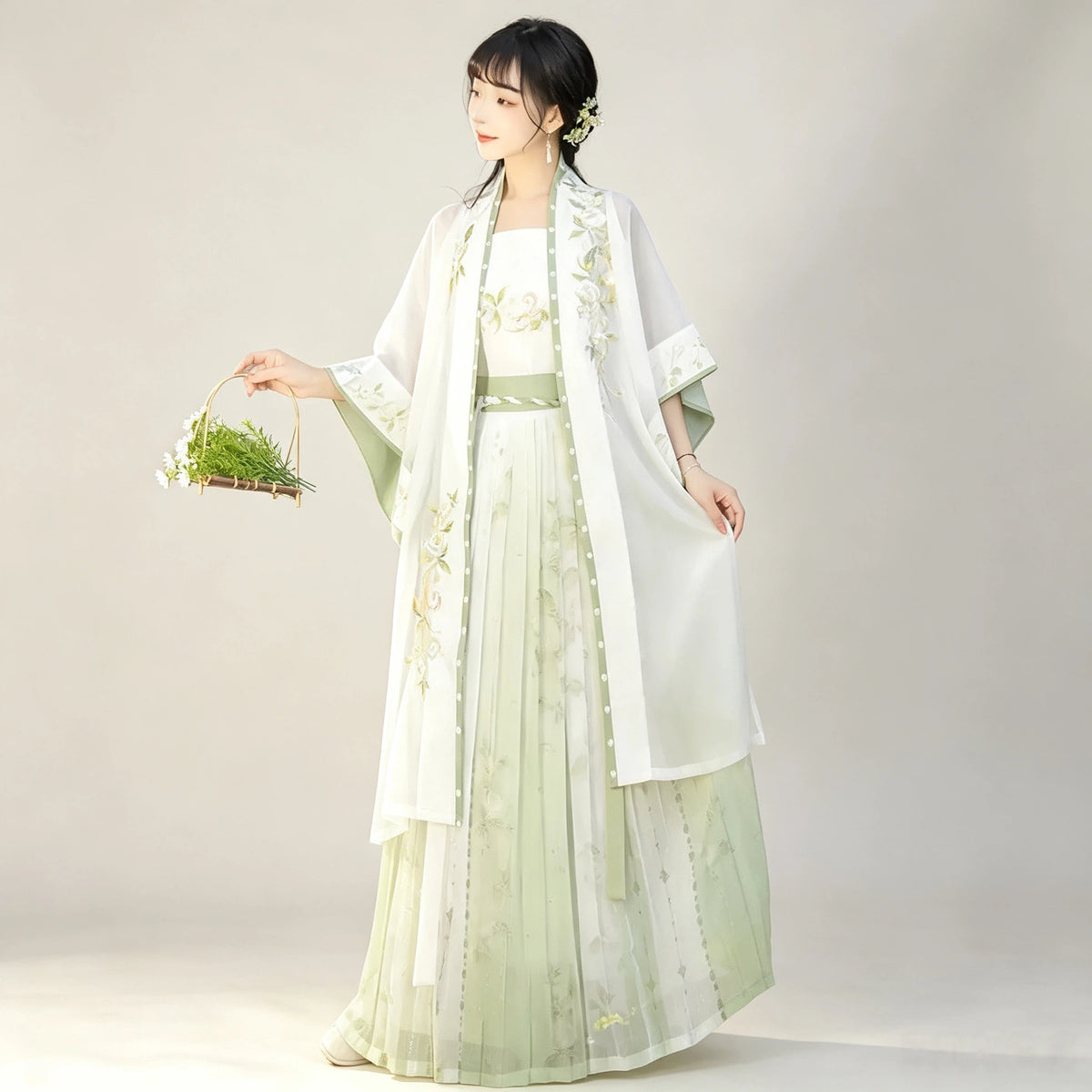 Sheer green Hanfu long cardigan paired with a white skirt