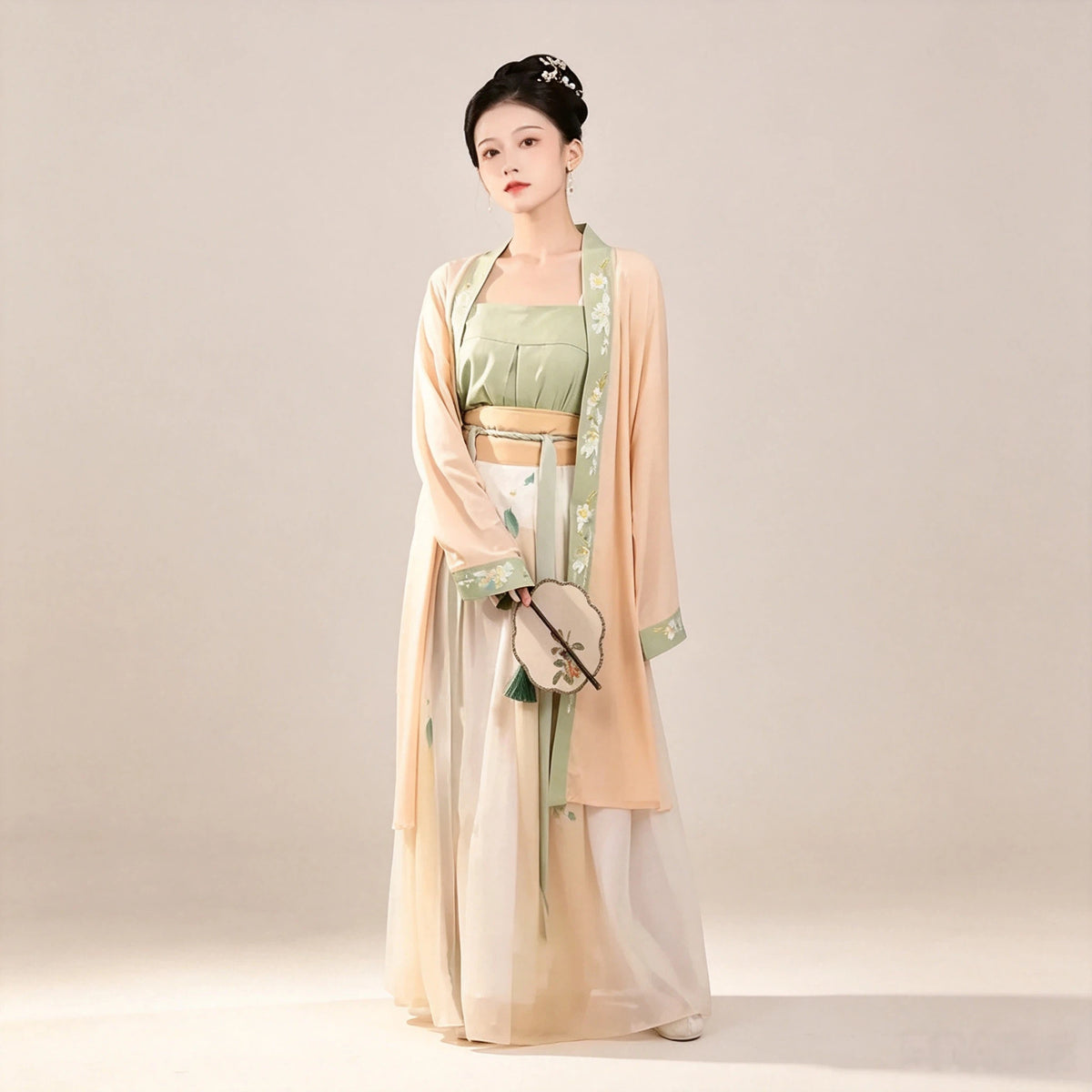 Pale orange Moxiong top paired with a sage green Hanfu outfit