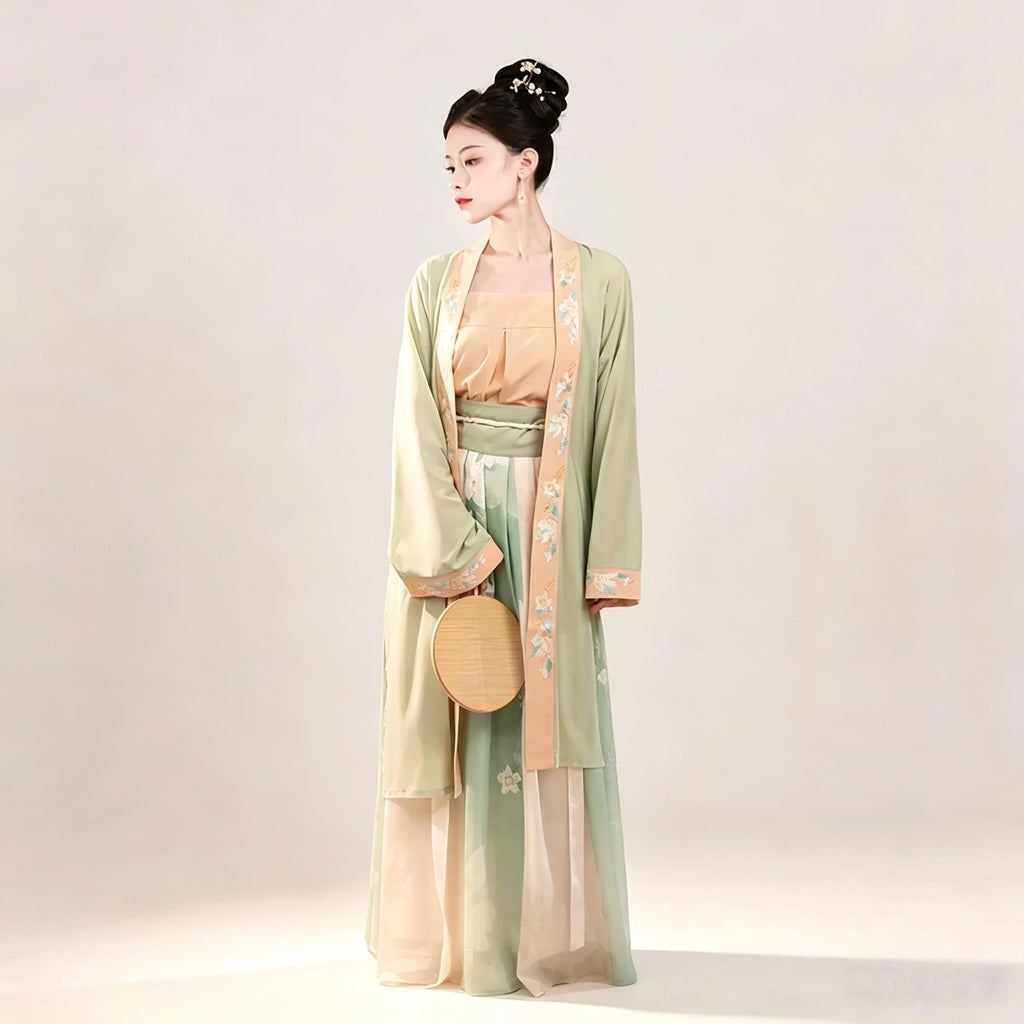 Song-style women's Hanfu with green outer cardigan and pleated skirt