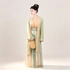 Song-style women's Hanfu with green outer cardigan and pleated skirt