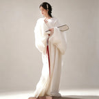 White Wei-Jin style Hanfu with sheer wide sleeves and red sash
