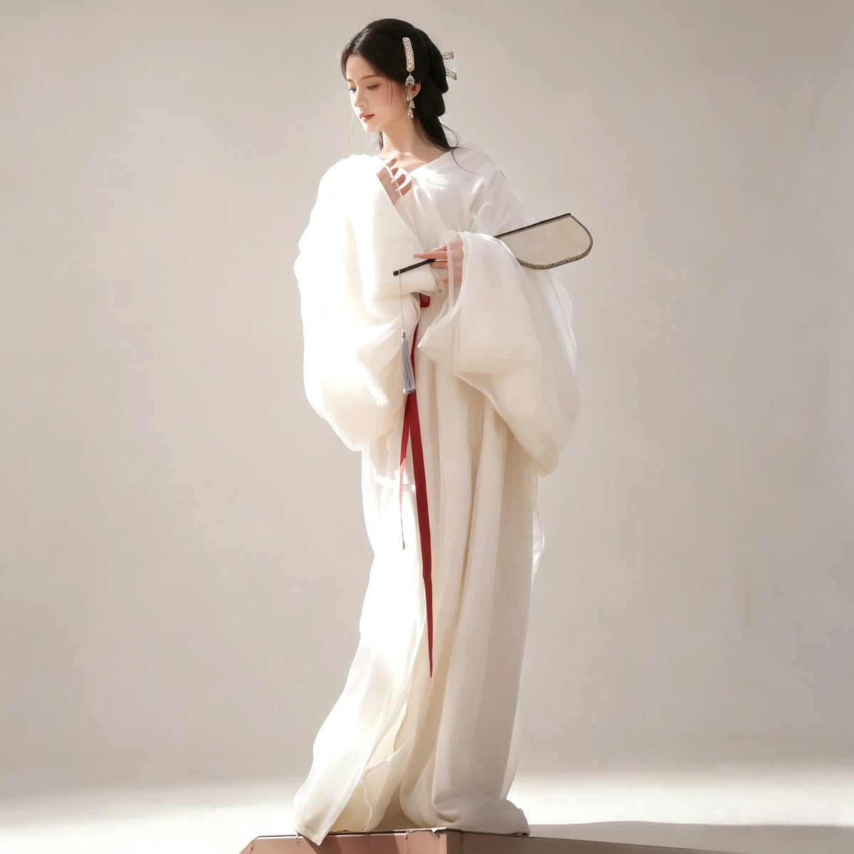 White Wei-Jin style Hanfu with sheer wide sleeves and red sash