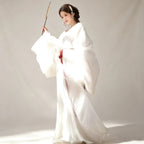 Women's flowing white Hanfu robe with a red waist tie
